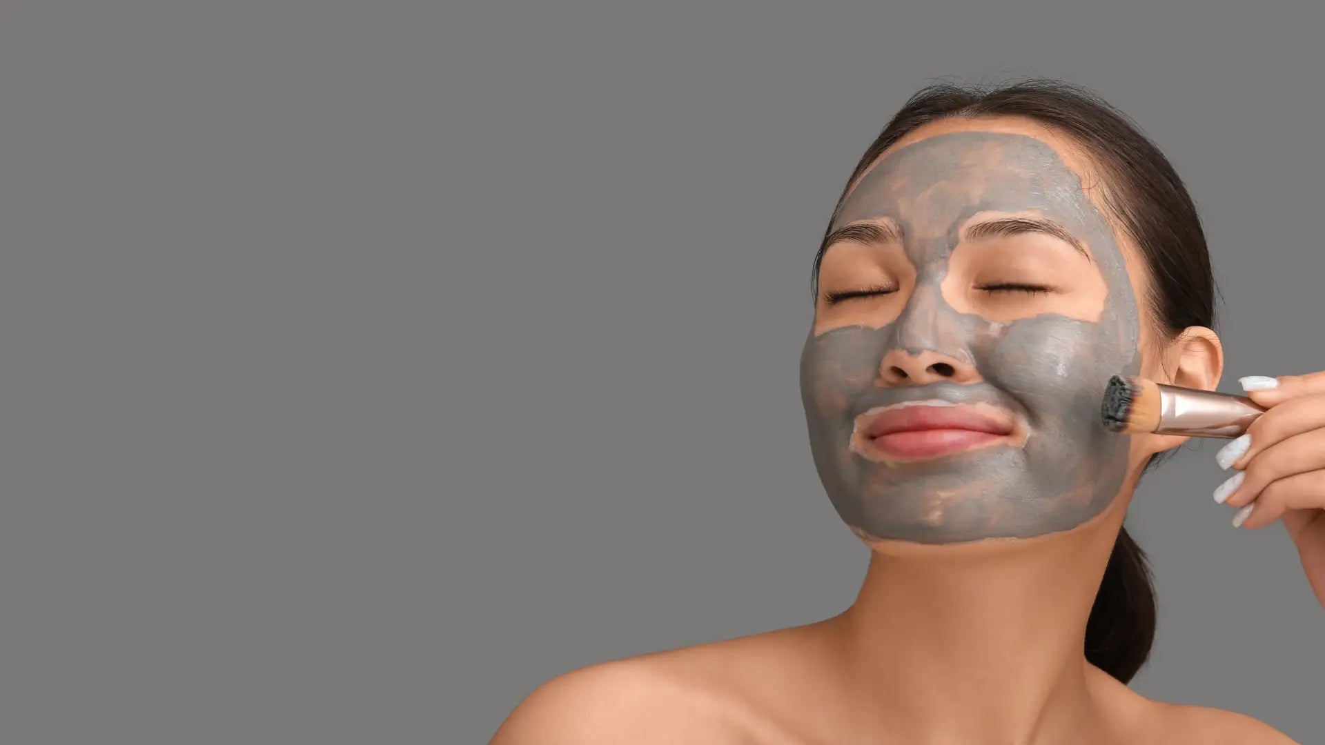 By Valenti Exfoliating Clay Masks Woman Applying Black Mask on Face