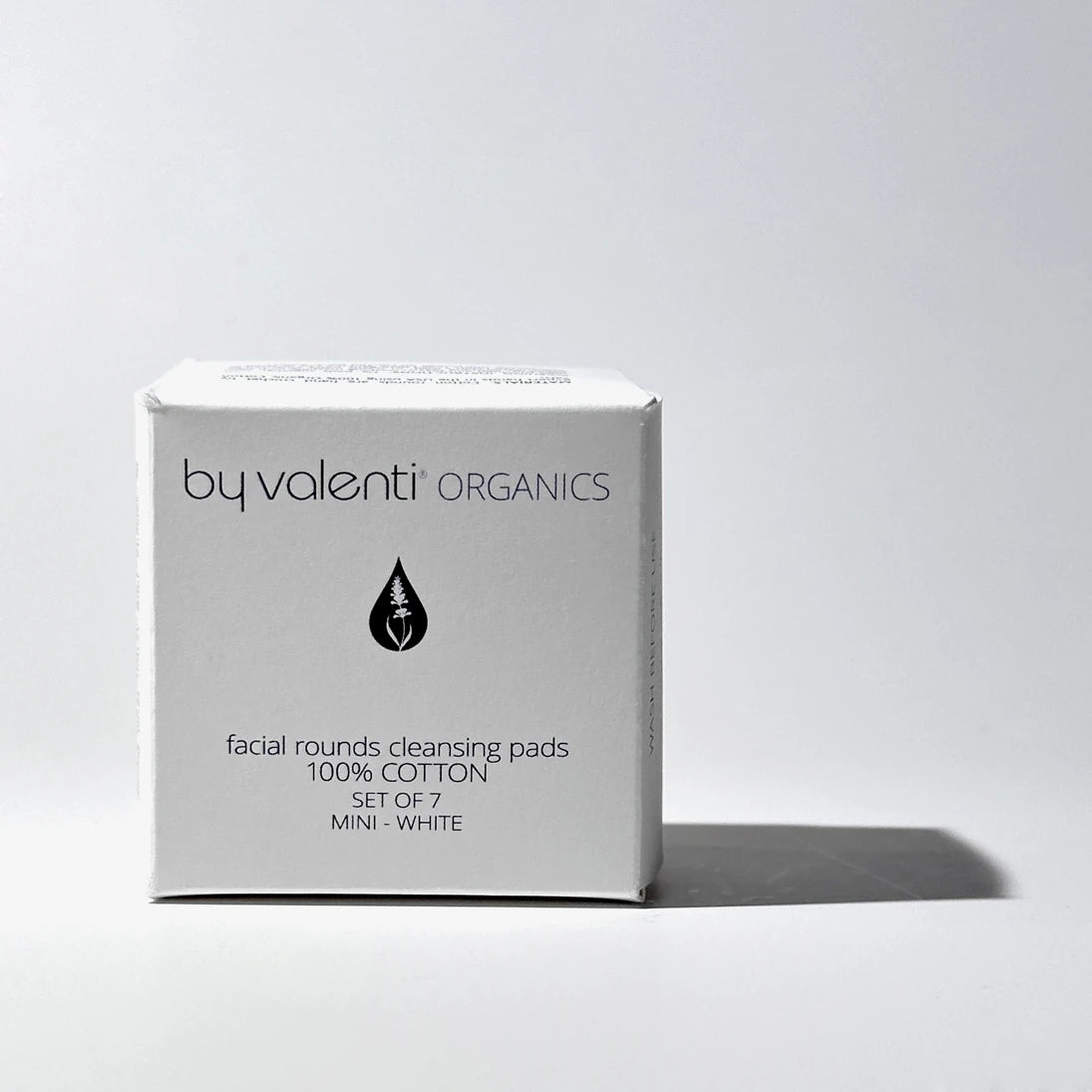 Box of by valenti Organics facial rounds cleansing pads on a light gray background
