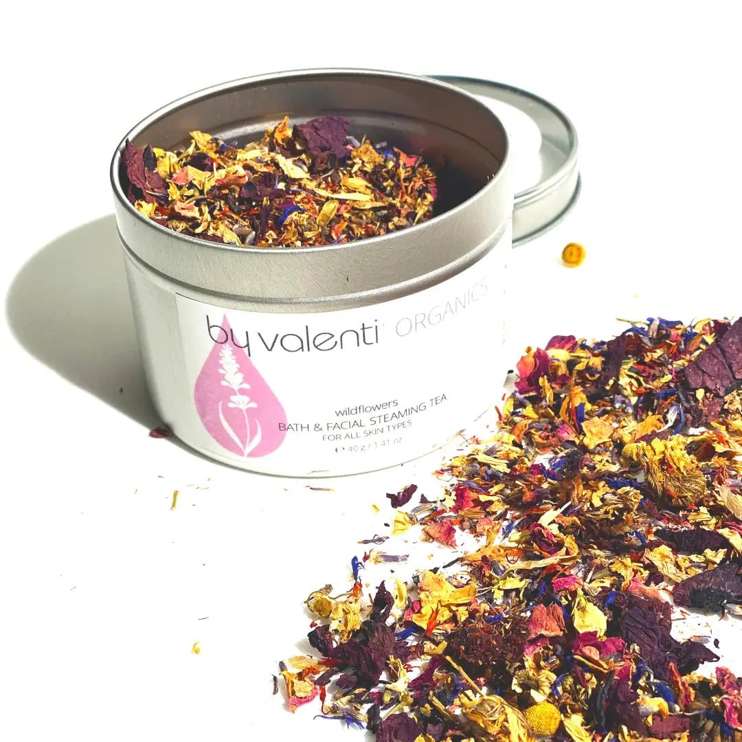 Bath and facial steaming tea with colorful herbs in a By Valenti Organic tin.