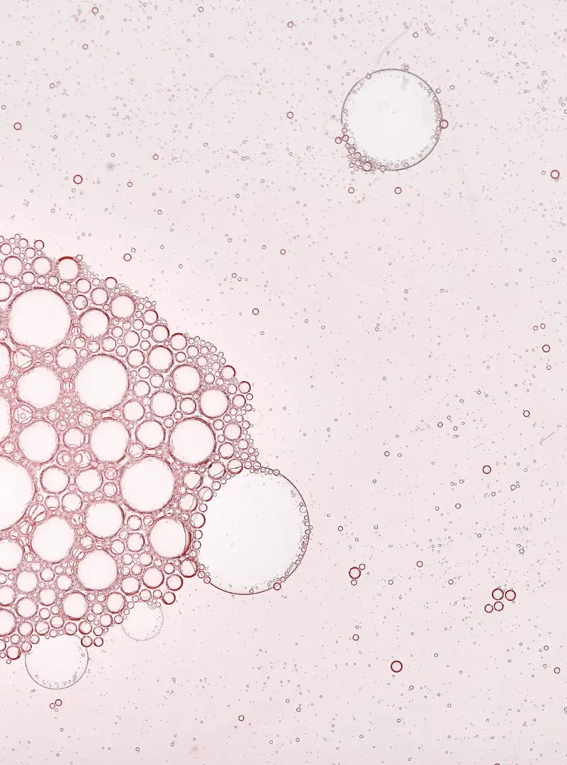 Pink bubbles on a light pink background